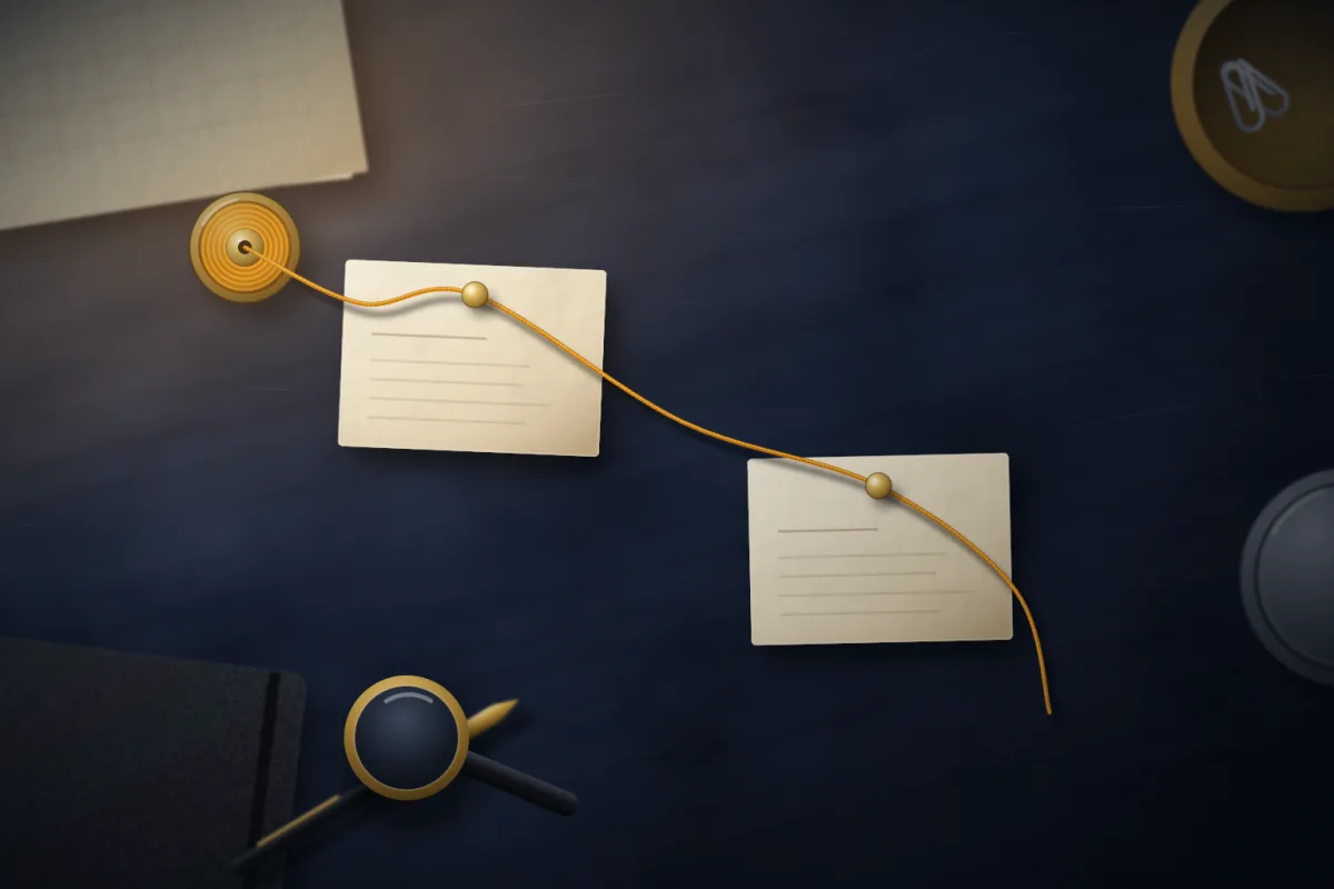 Illustration of two cream index cards pinned to a dark desk and joined by an amber thread; not a product screenshot